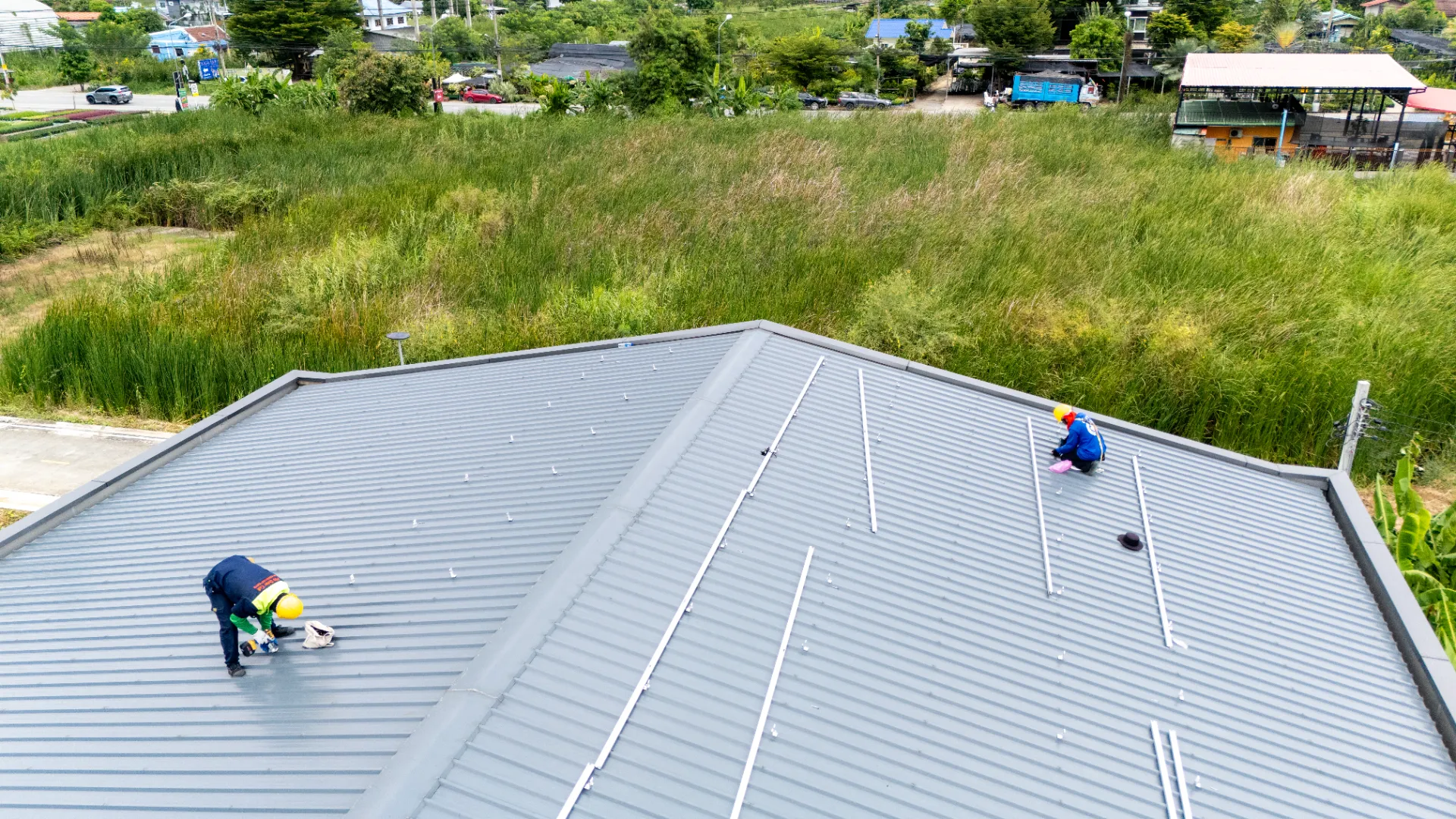 Roofer inspecting shingles for damage