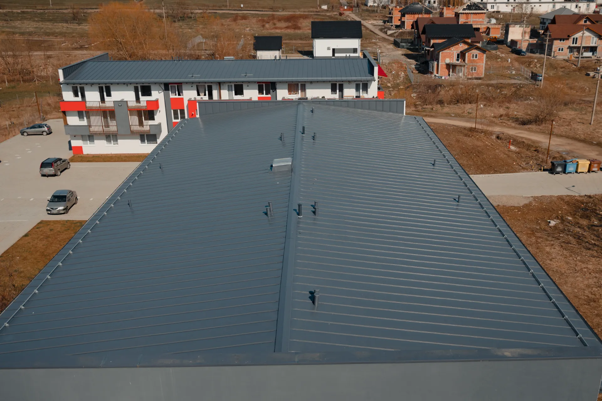 Roofer inspecting shingles for damage