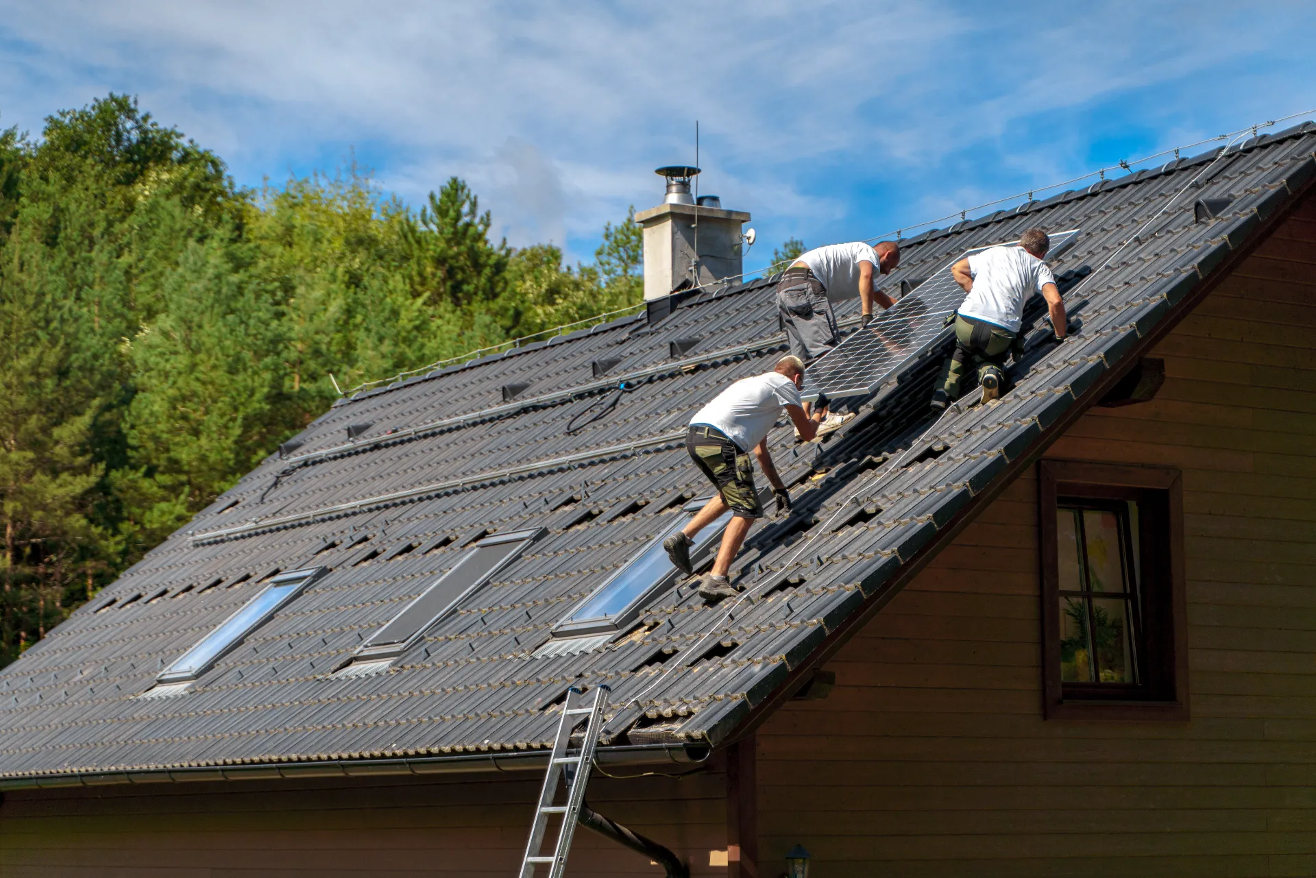 Roofer inspecting shingles for damage